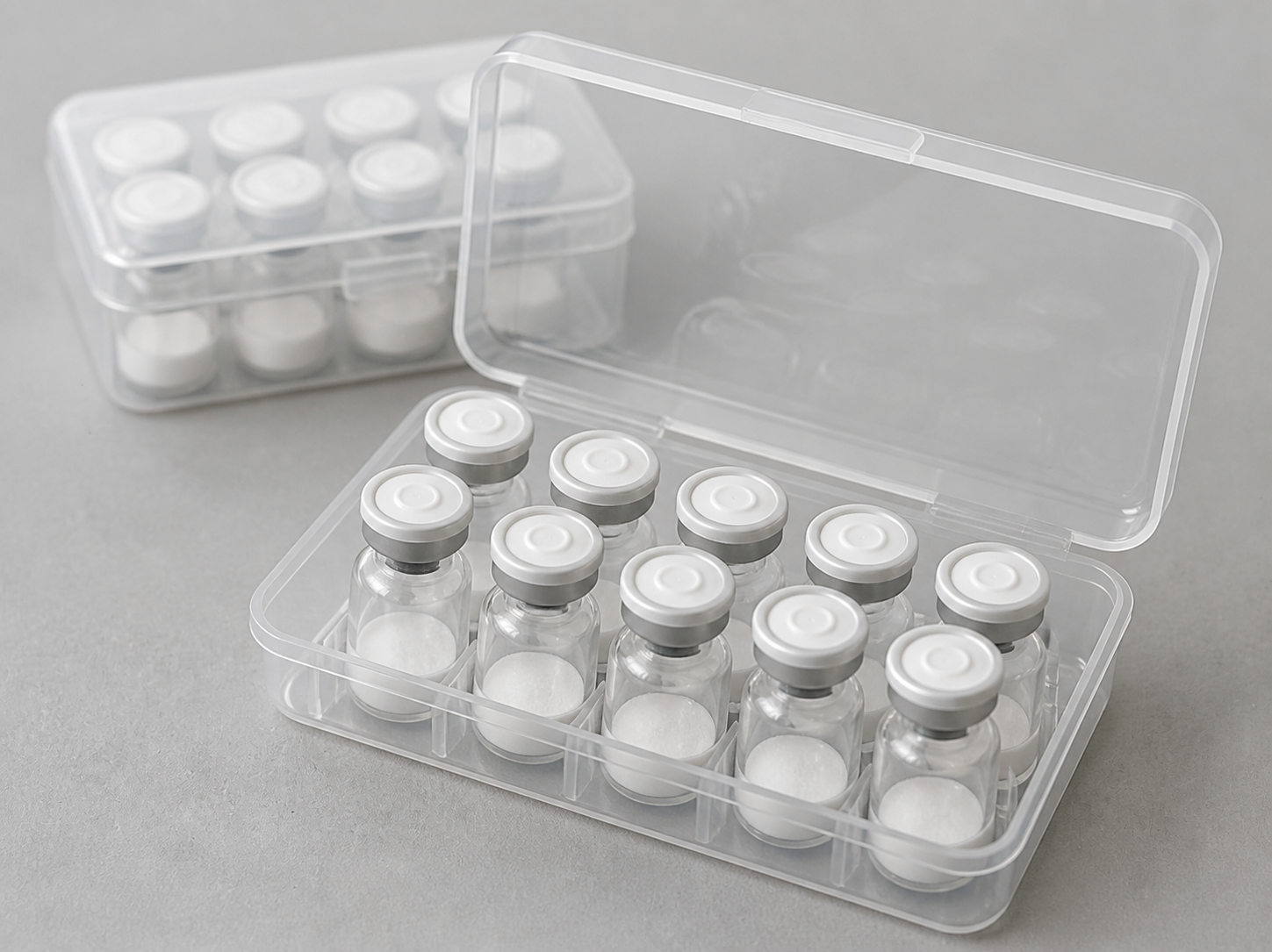 Close view of an open clear box with ten lyophilized vials